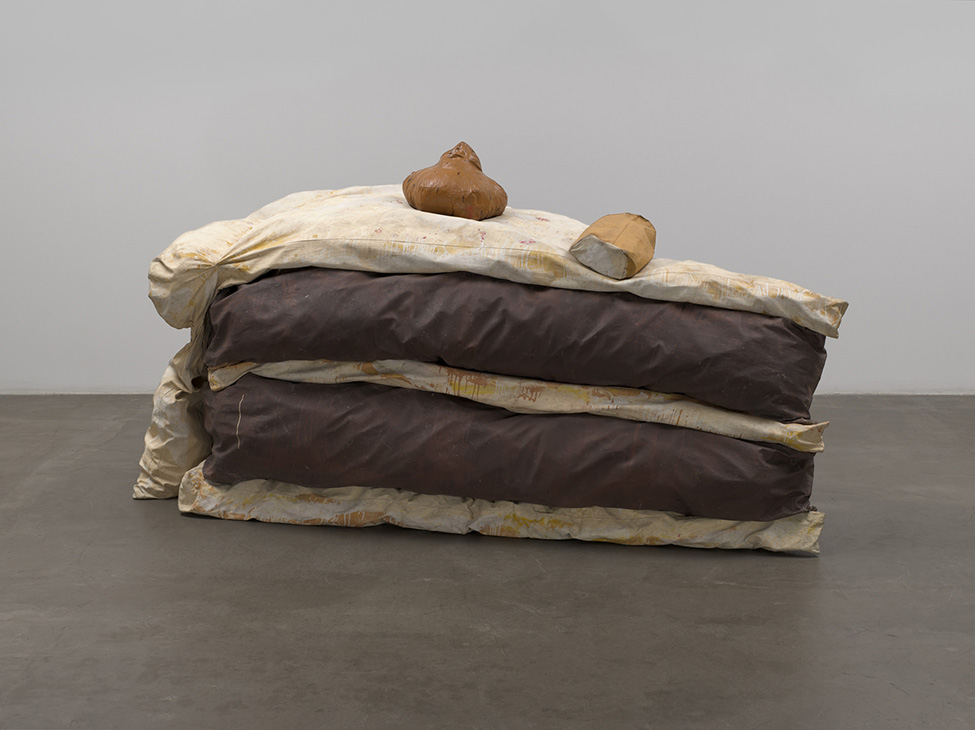 Claes Oldenburg. Floor Cake, 1962. Synthetic polymer paint and latex on canvas filled with foam rubber and cardboard boxes, 58 3/8 inx 9 ft. 6 ¼ in x 58 3/8 in.  Gift of Philip Johnson. Museum of Modern Art.  