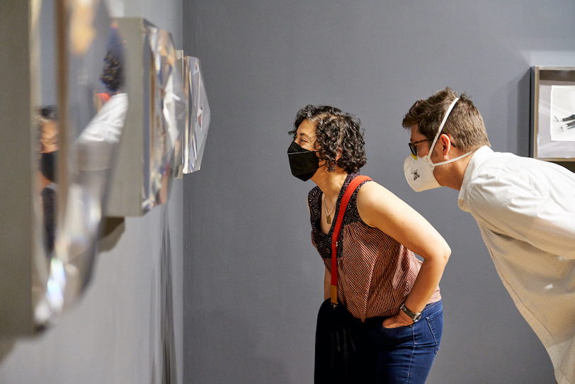 Visitors wearing KN95 masks view artworks in the Frye's galleries. 