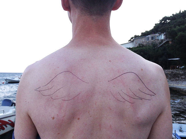 Photo of a person with wings drawn on their back