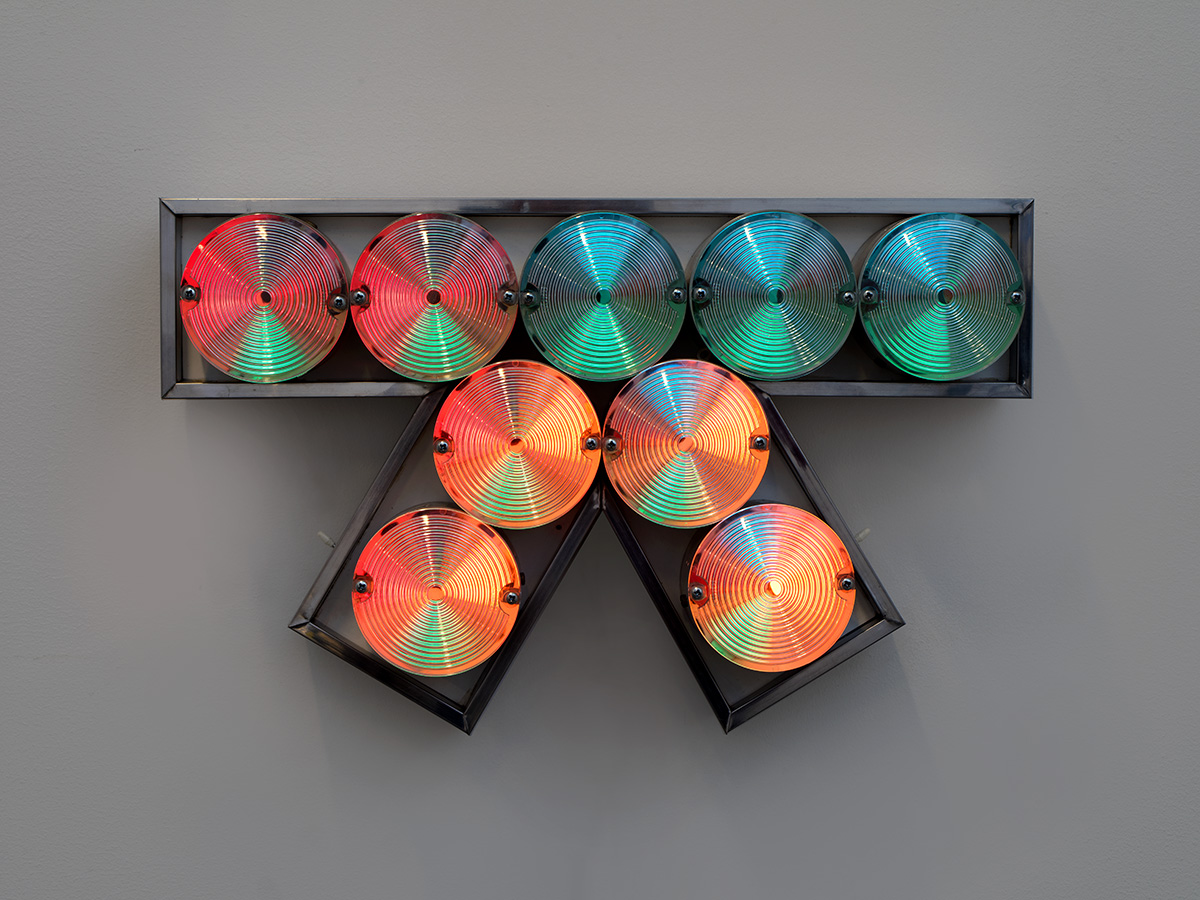 A geometric artwork made up of circular lights in a frame