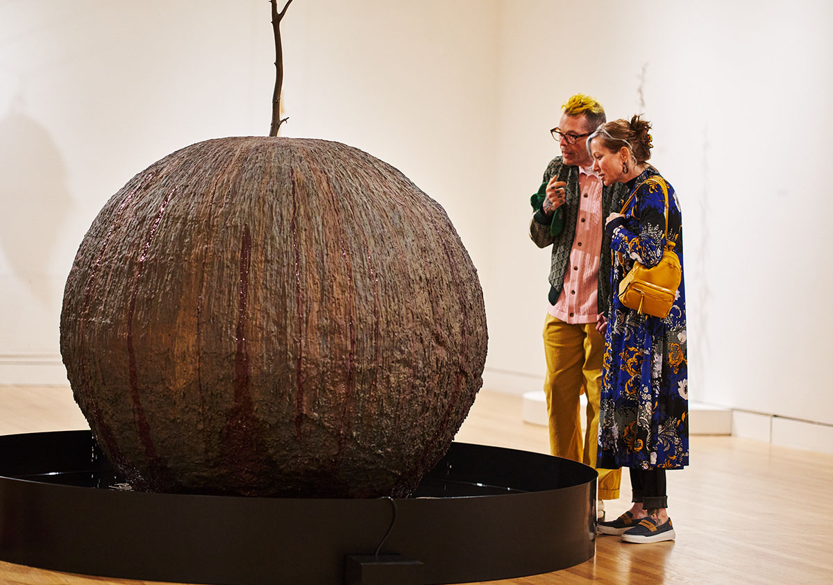 People look at an installation in the Kelly Akashi: Formations exhibition