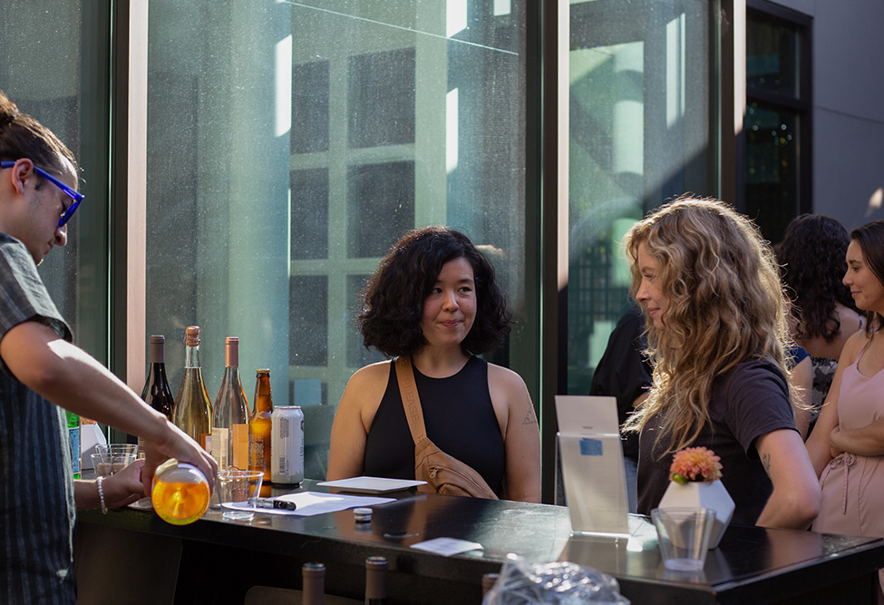 People getting a drink at a bar