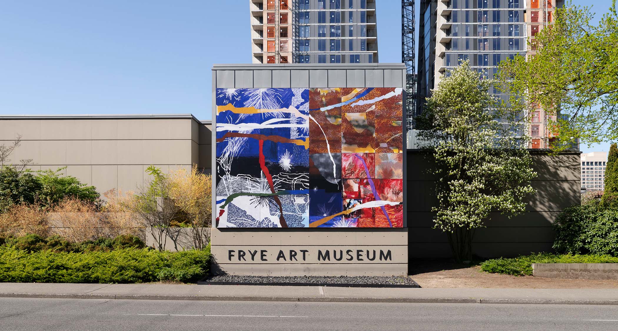 North facing exterior of the Frye Art Museum building, featuring a Boren Banner by artist Russna Kaur
