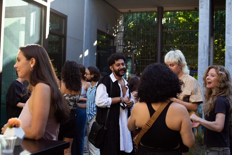 Guests mingling at the Young Supporters Happy Hour, July 29, 2021. Photo: Julia Kuskin 