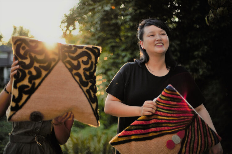 Tenzin with pillows she designed