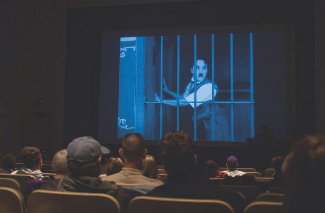 Audience watching a film in an auditorium 