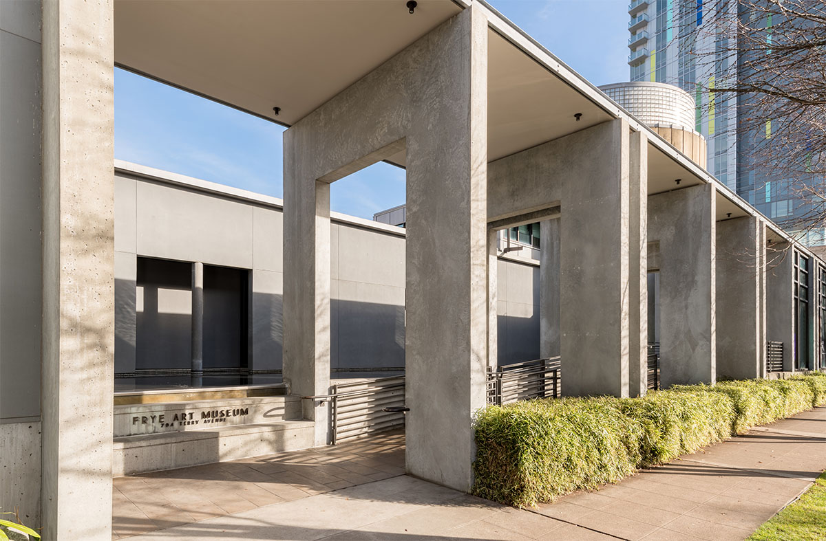 Exterior of the Frye Art Museum showing architectural features included a reflecting pool and covered entryway ramp