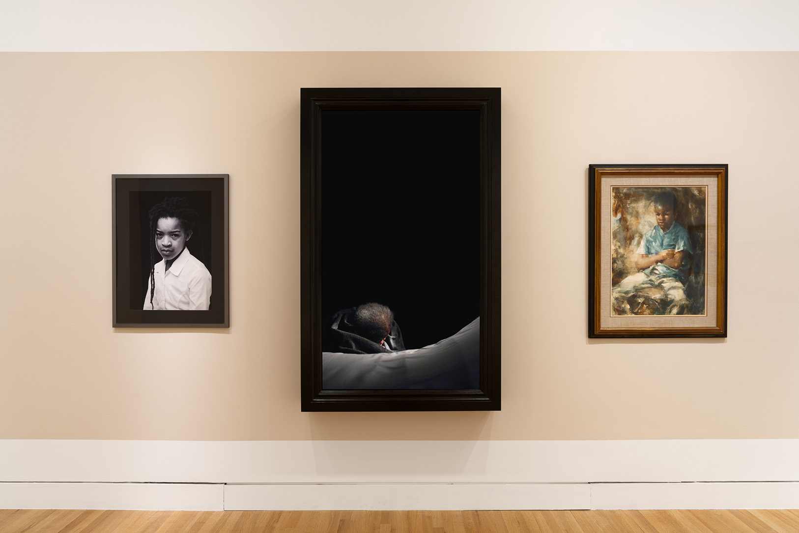 Three artworks on a wall