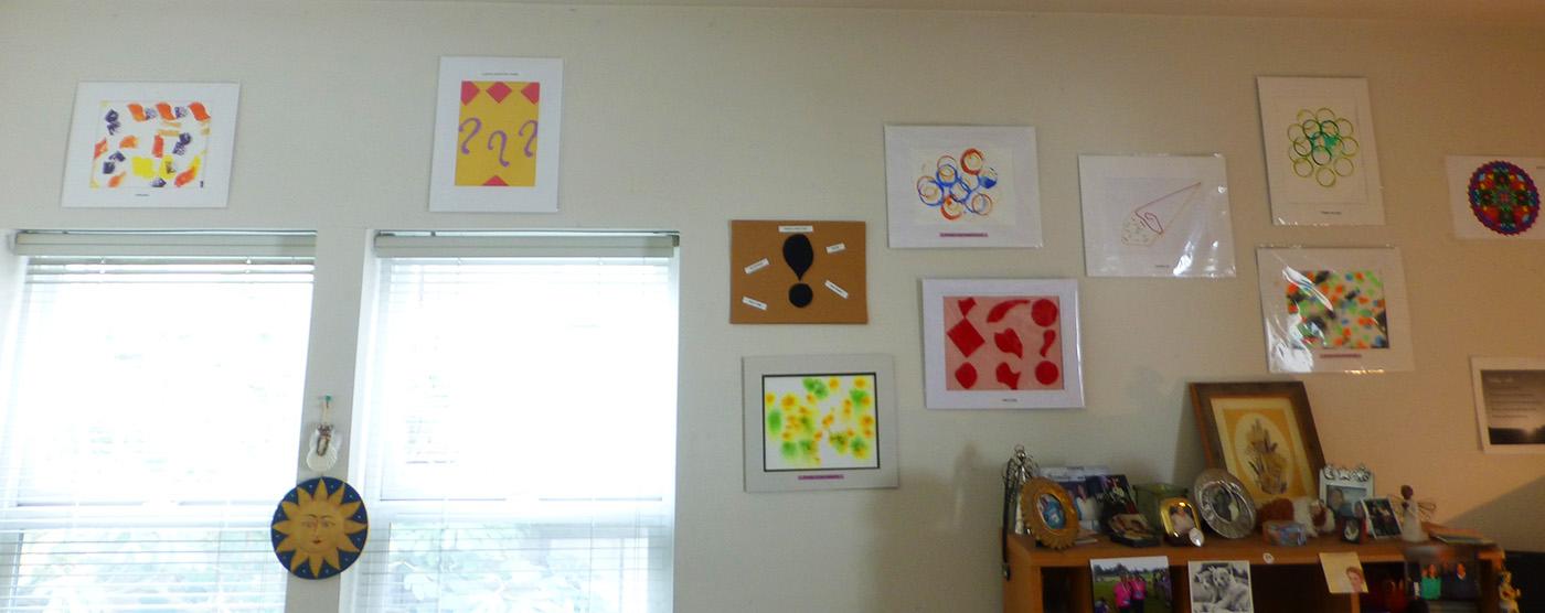 Small artworks on a wall inside a home