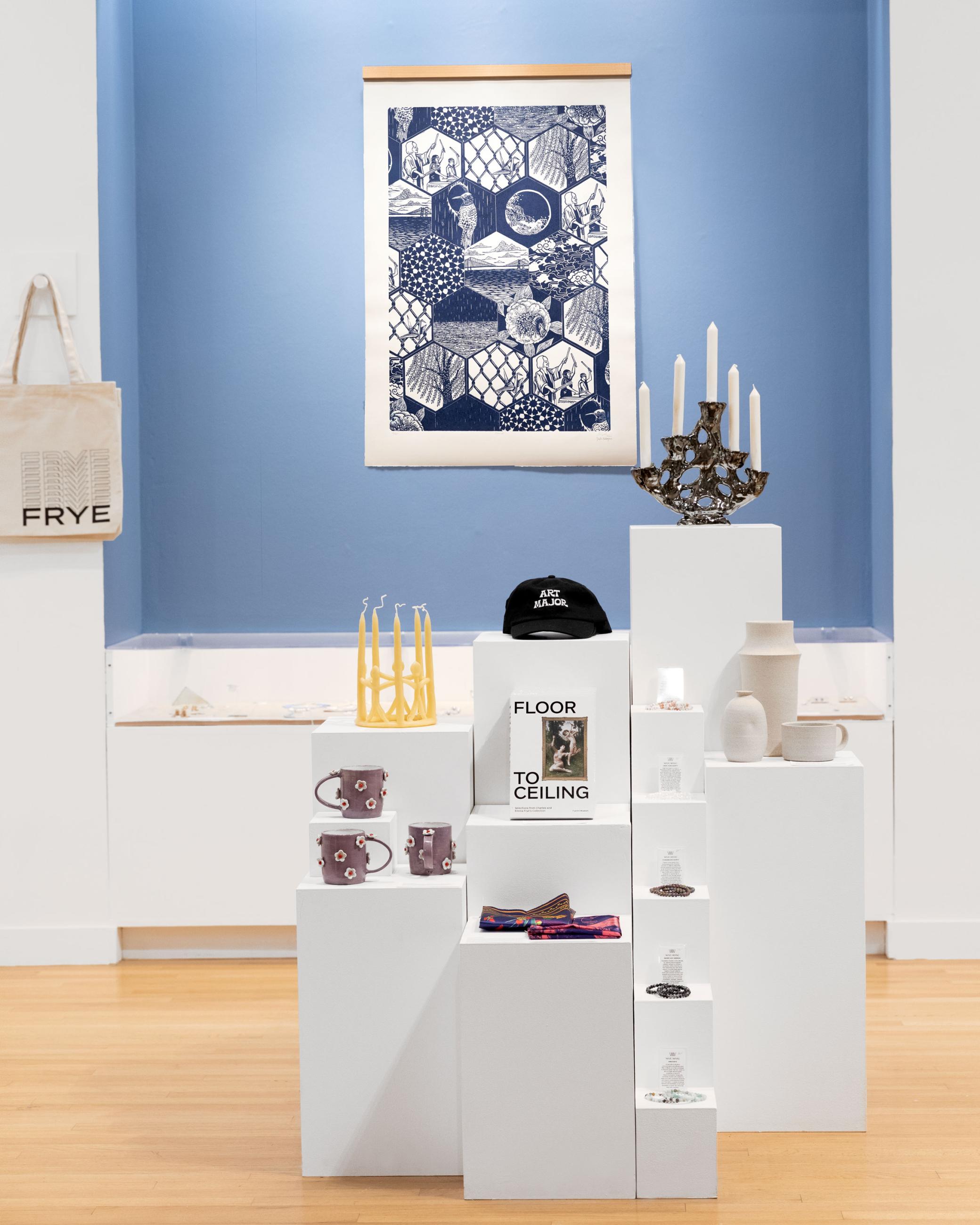 "Sound," a blue and white linocut artwork, hanging in the Frye Art Museum Store Alcove