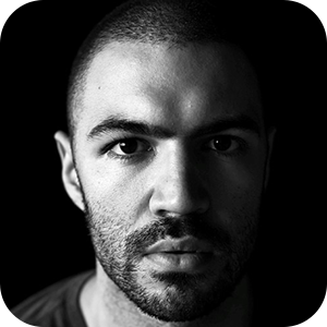 A dramatic, close-up, black and white portrait photograph