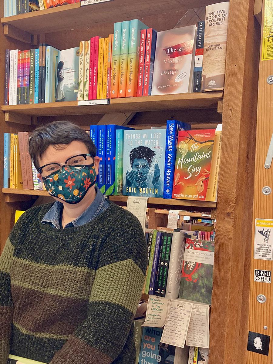 Micah Nemerever in a bookstore