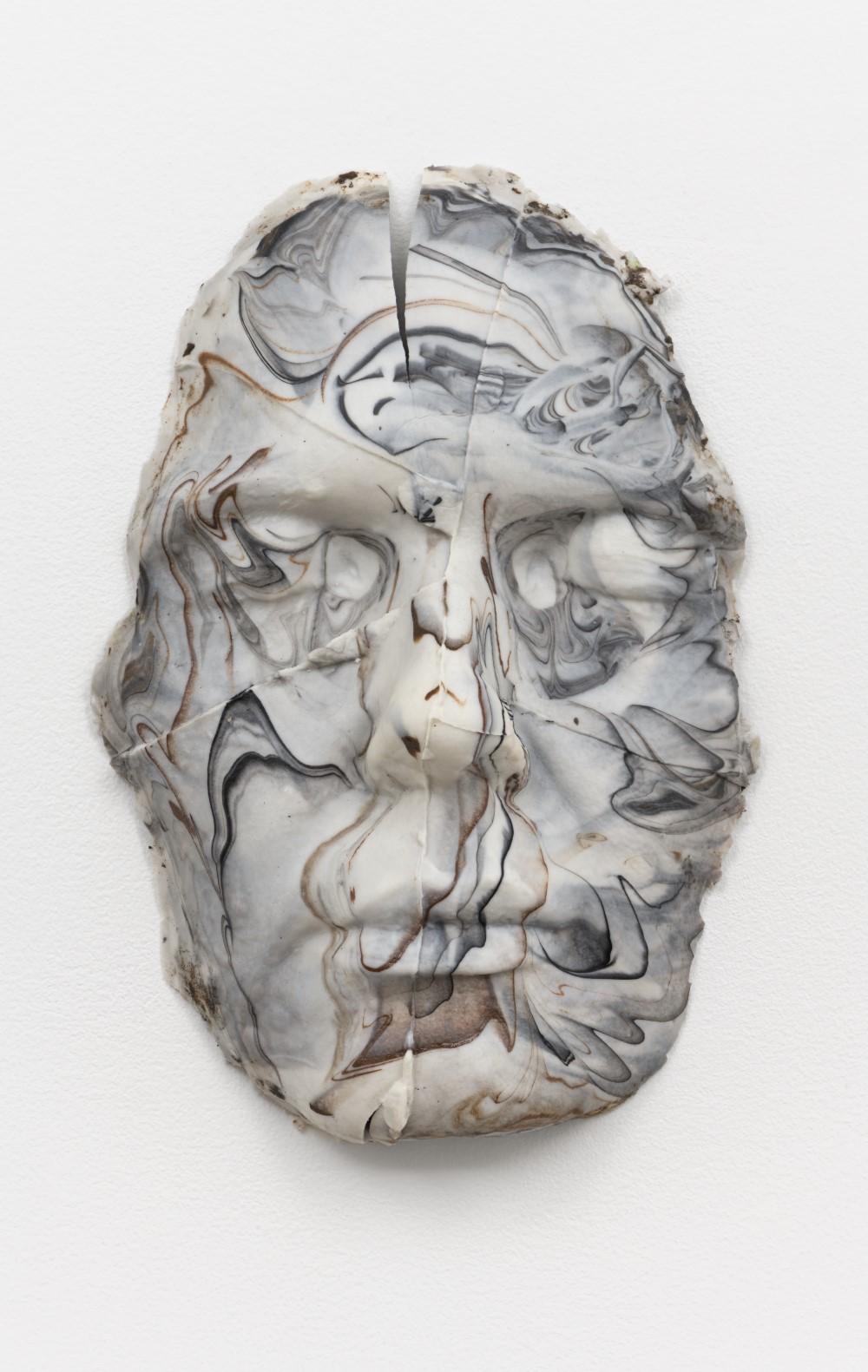 White, marbleized silicone sculpture of a face