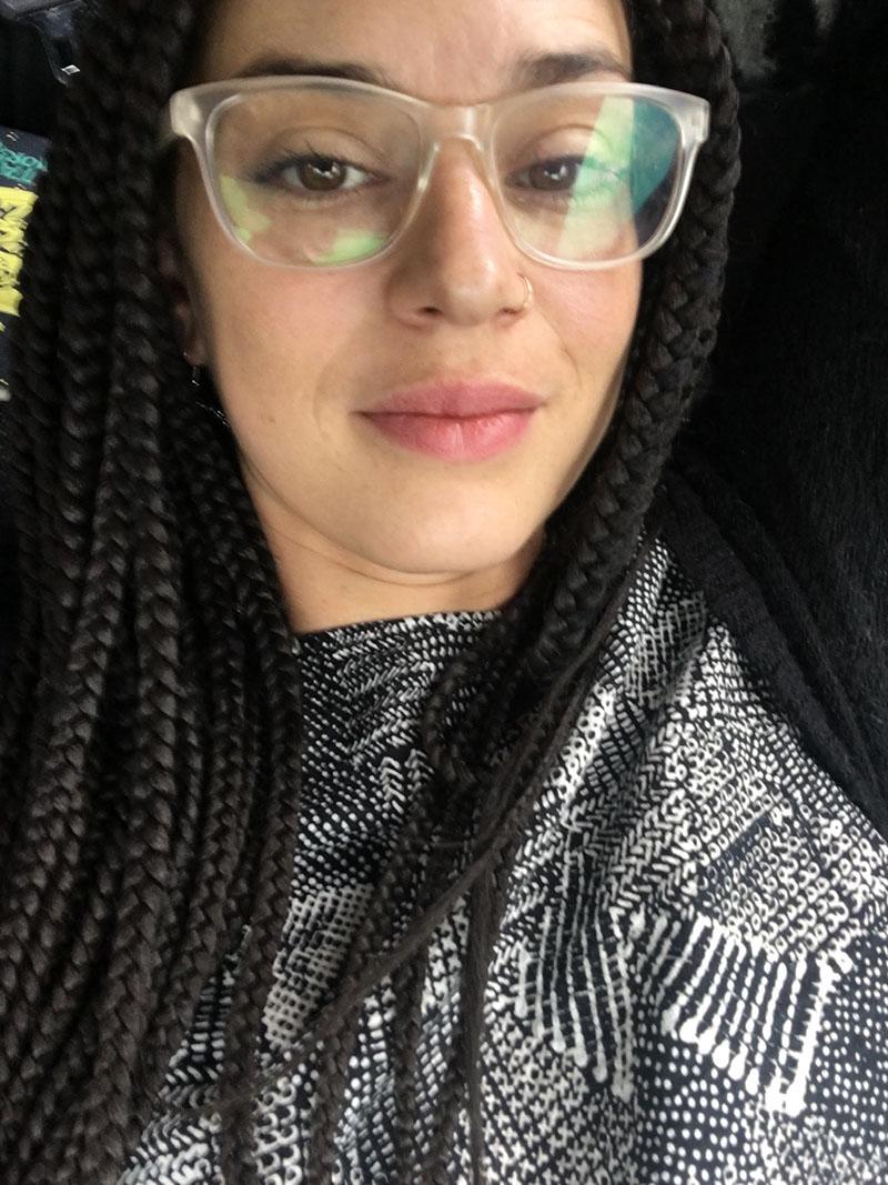 A selfie style photo of a woman wearing large glasses