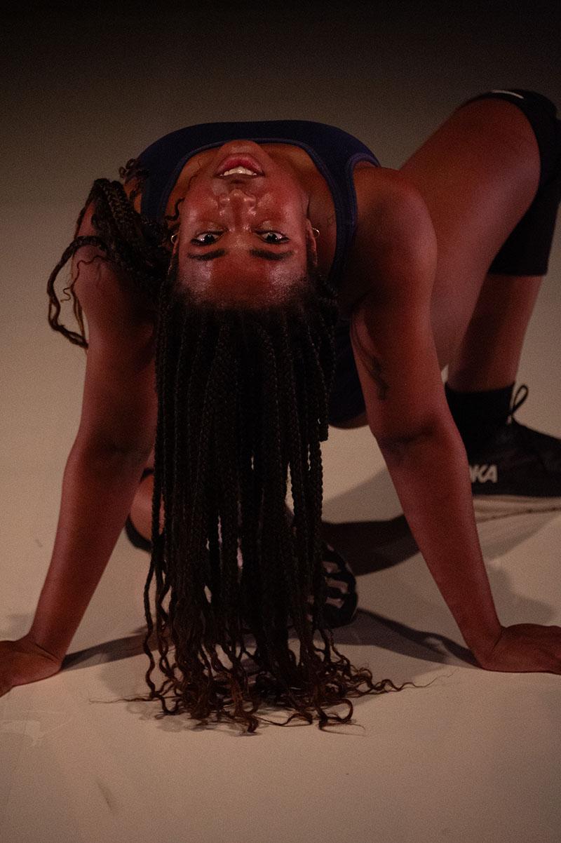 A woman doing a back bend during a dance performance