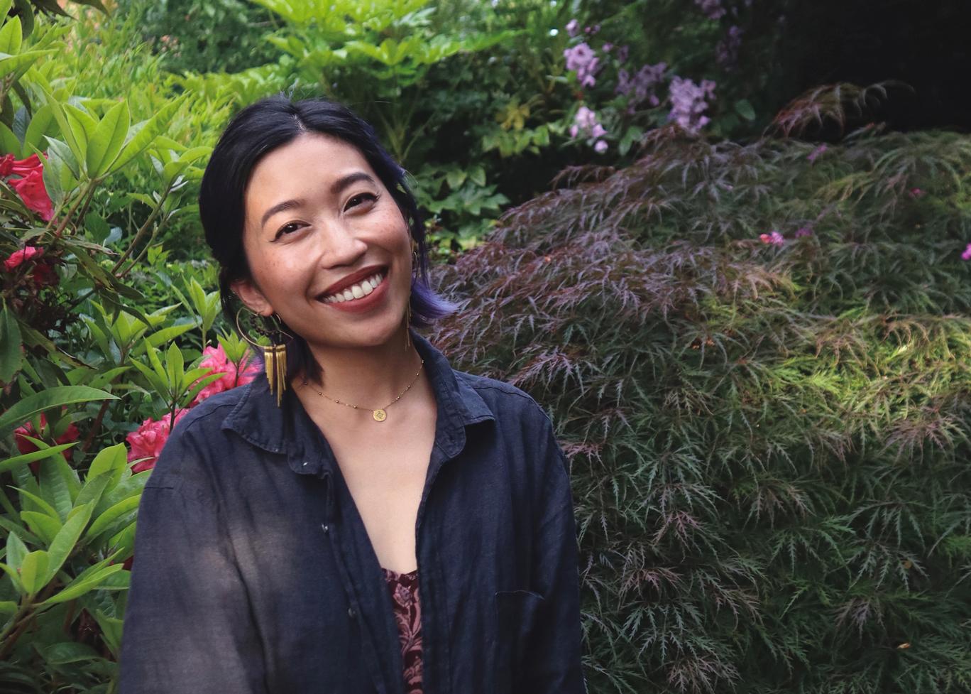 Artist lexa toledo villanueva smiling in a forested environment