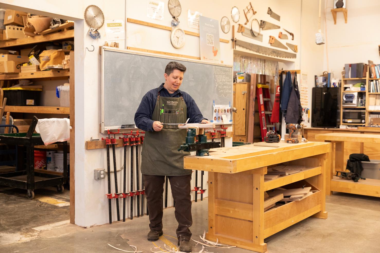 Kim McIntyre working in a woodshop