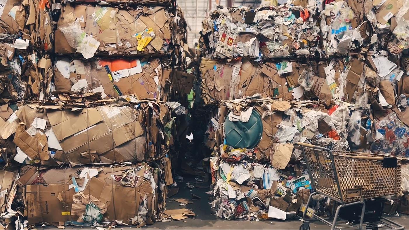 Tall stacks of bundled up papers and cardboard for recycling