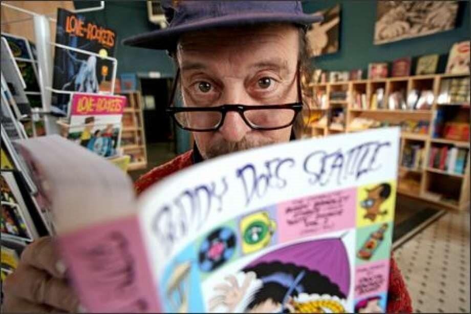 A person wearing a hat looking over their glasses while holding a book